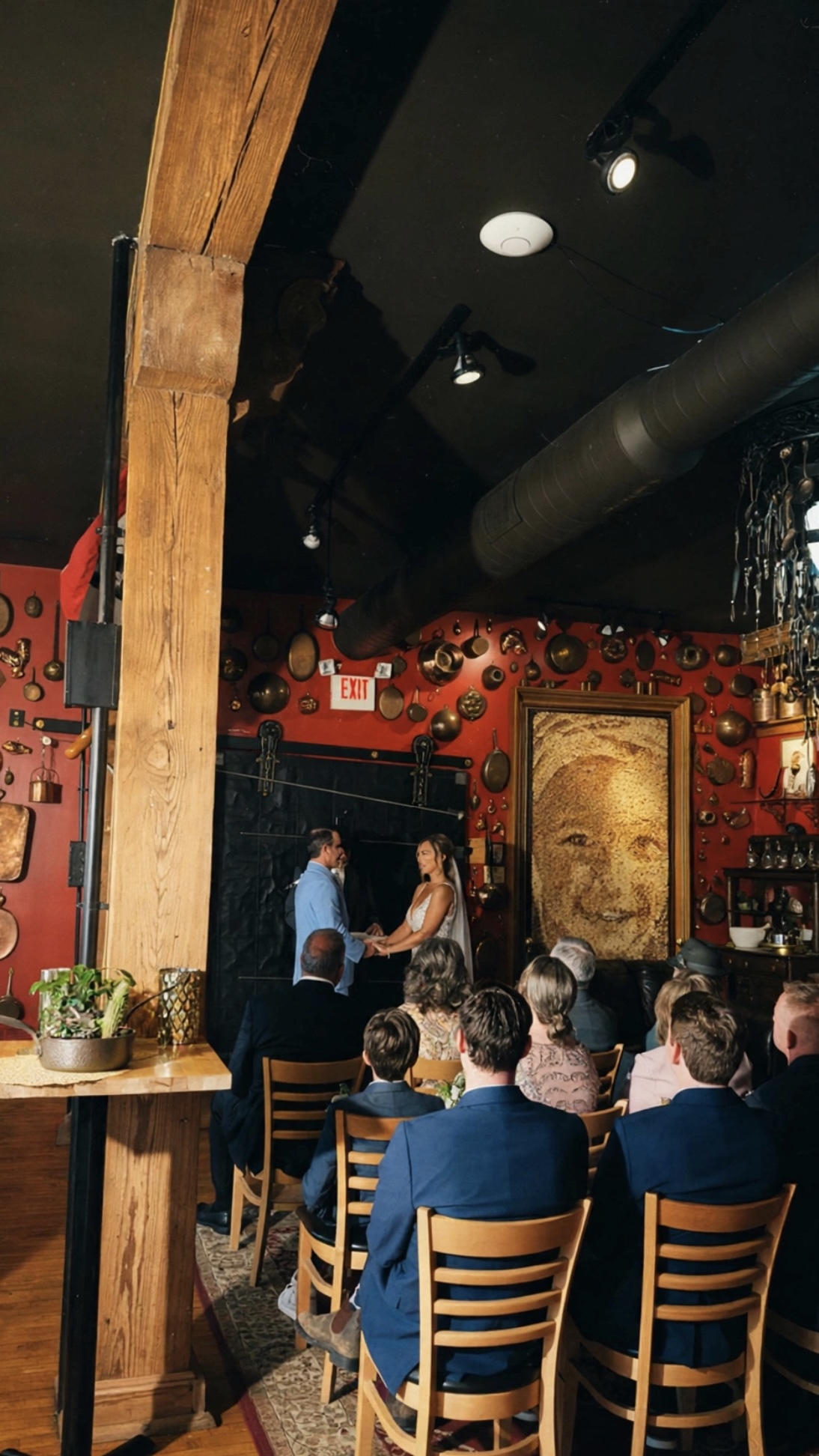 Wedding ceremony with guests at a cozy restaurant venue