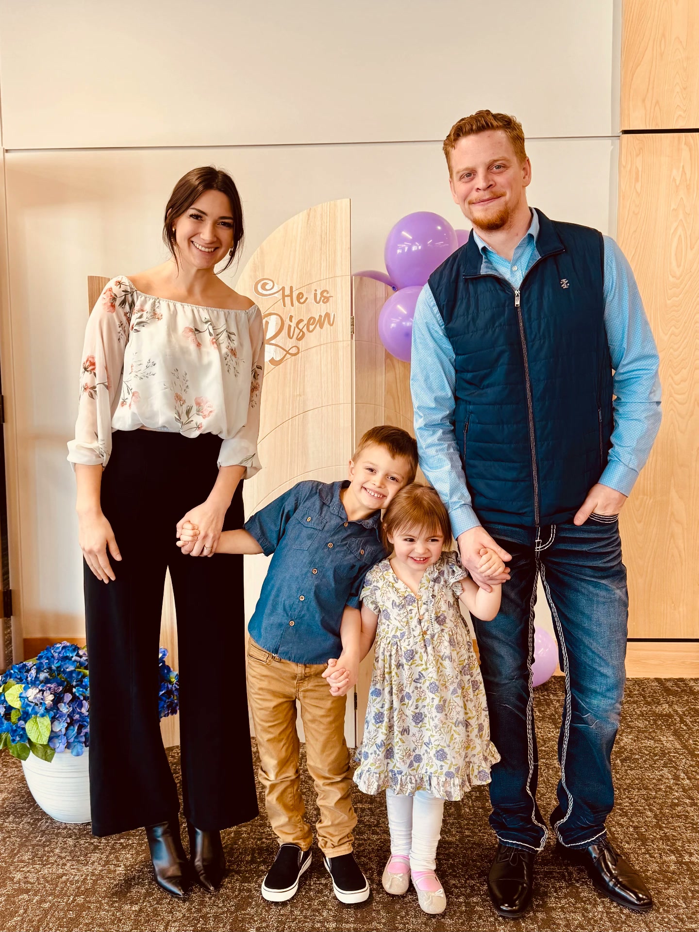 Anna Marie with her husband and two children at a spring celebration