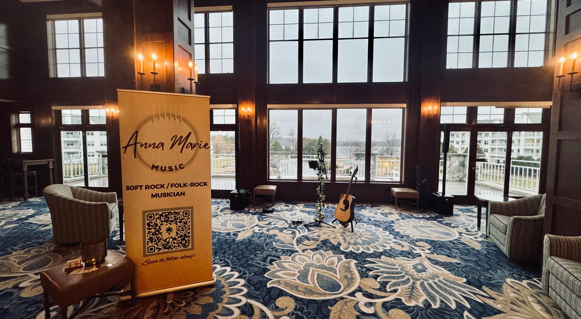 Anna Marie Music banner and setup at a lakeside venue