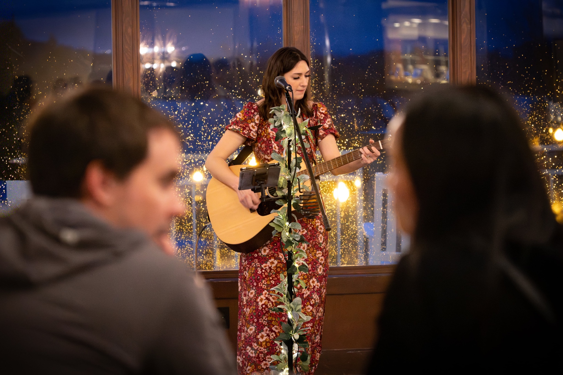 Anna Marie performing live with guests in the foreground